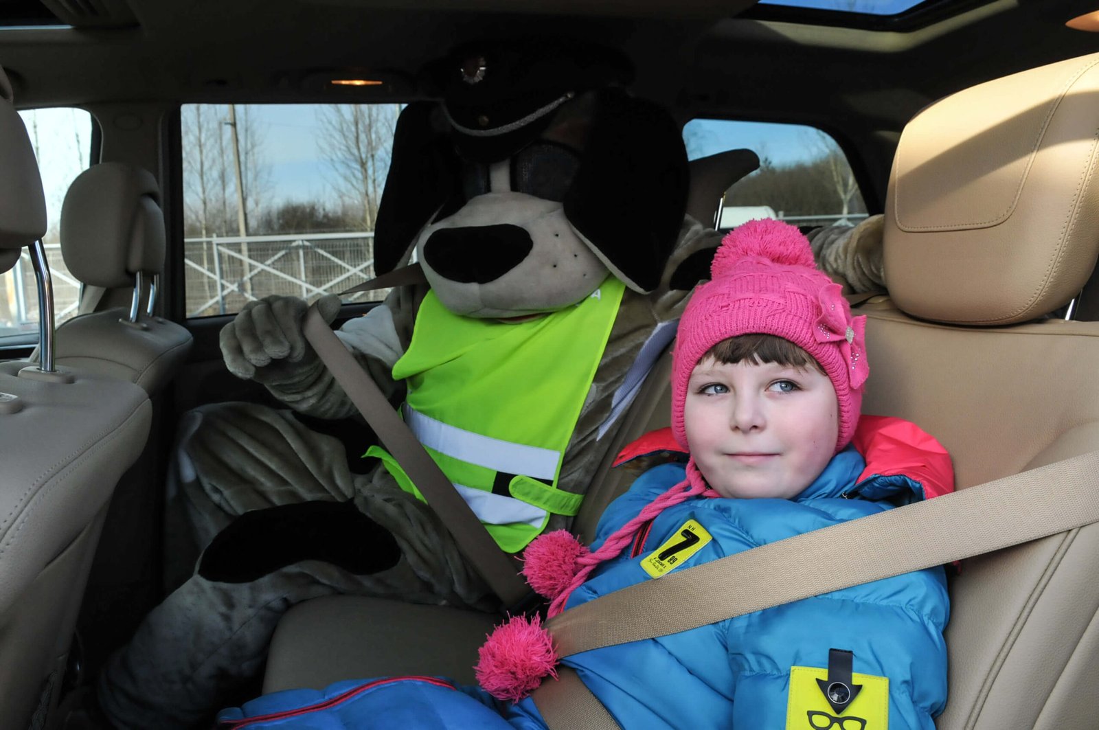 In the back seat – only with seat belts!