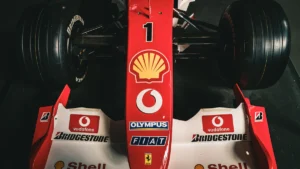 Front view of a red formula-style racing car showing its nose and front wing; illustrative photograph, not a 2026 aerodynamic specification